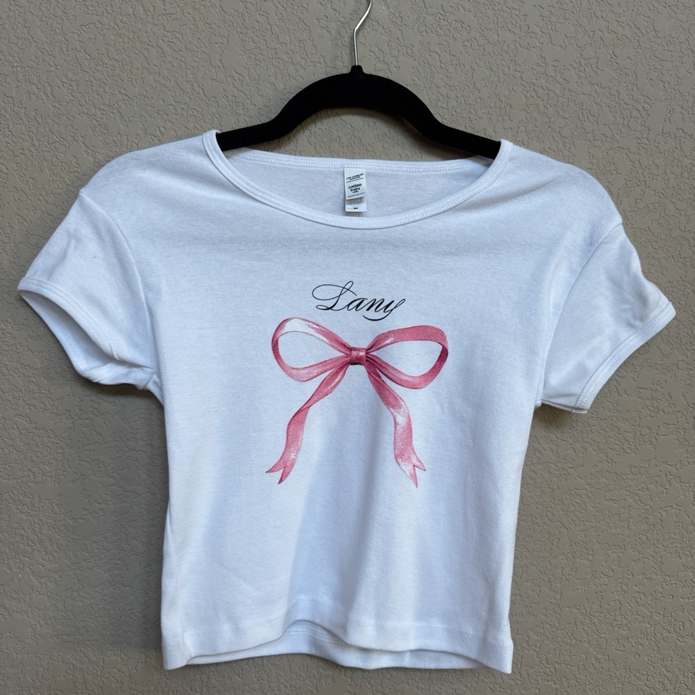 🎤 New Without Tags - White Baby Bow Tee – “Lany” Graphic